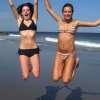 Girls jumping into the sea