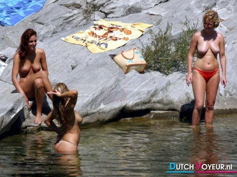 Topless women in a lake