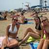 Girl group on the beach smiling for the camera