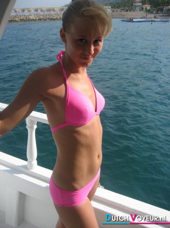Slim girl in bikini on a boat