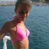 Slim girl in bikini on a boat