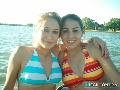 Girlfriends love each other in a boat