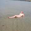A recreational lake with teen in bikini