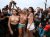 Topless Protest Rio falls into the water